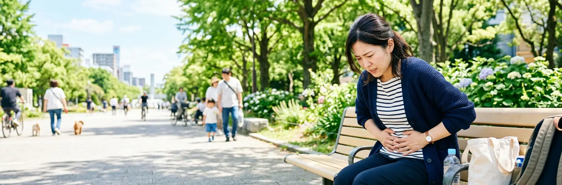 冷房の冷えやお腹のゆるさに悩む30代女性（慢性下痢の症状イメージ）